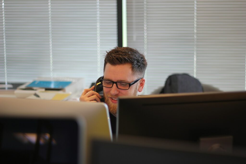 AI answering service cost compared with staff answering office phones