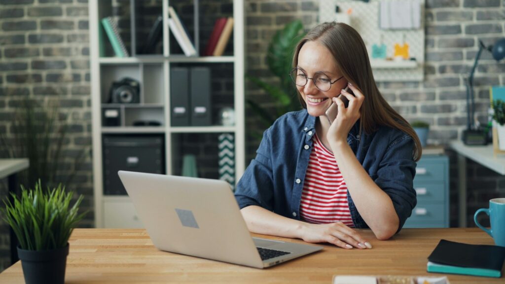 AI receptionist cost - small business owner answering a client call