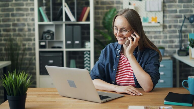 AI receptionist cost - small business owner answering a client call