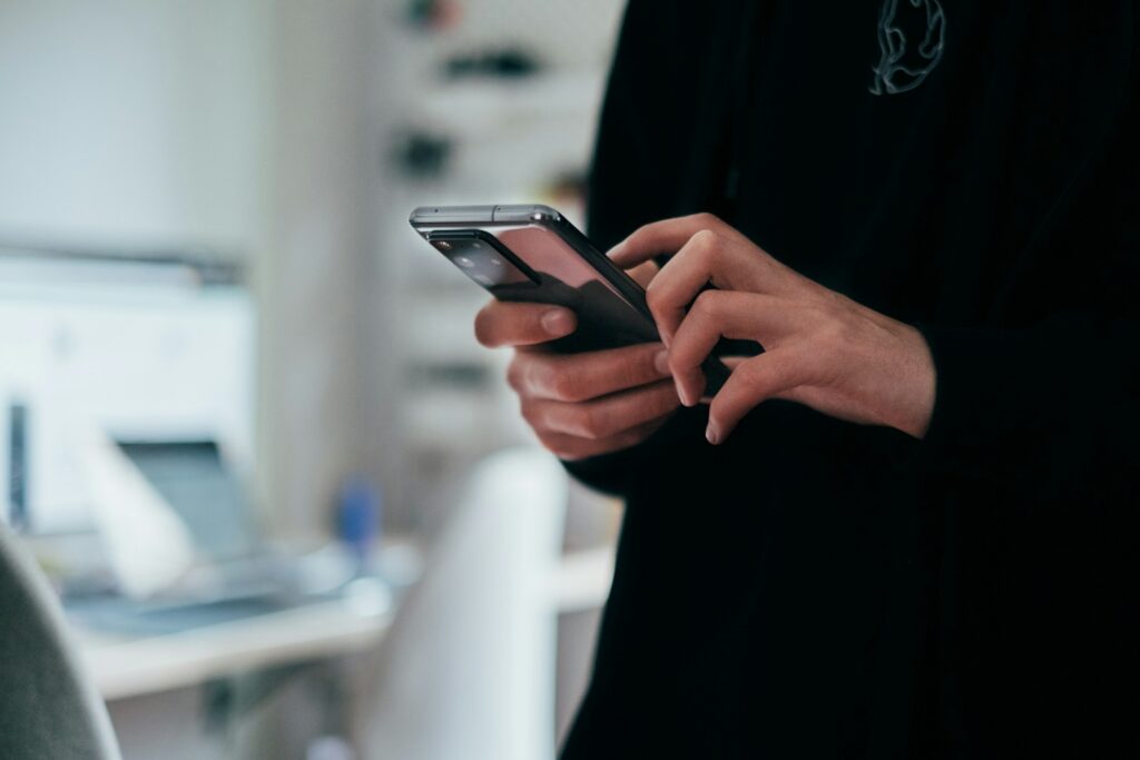 Customer reading a text back message on a smartphone